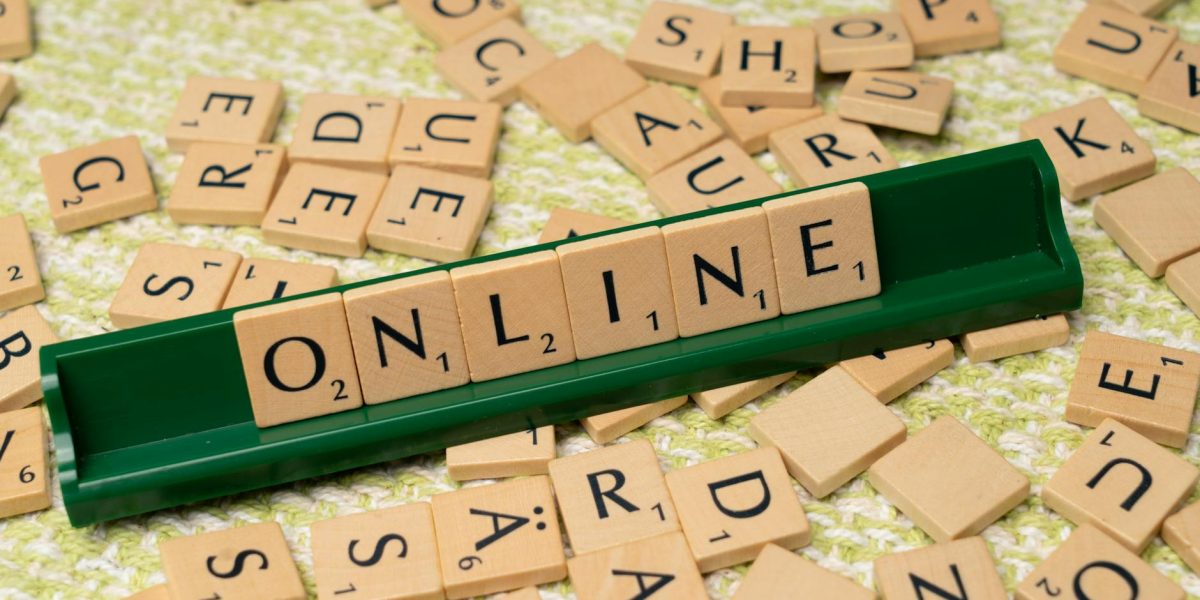 the word online is spelled out with scrabble tiles